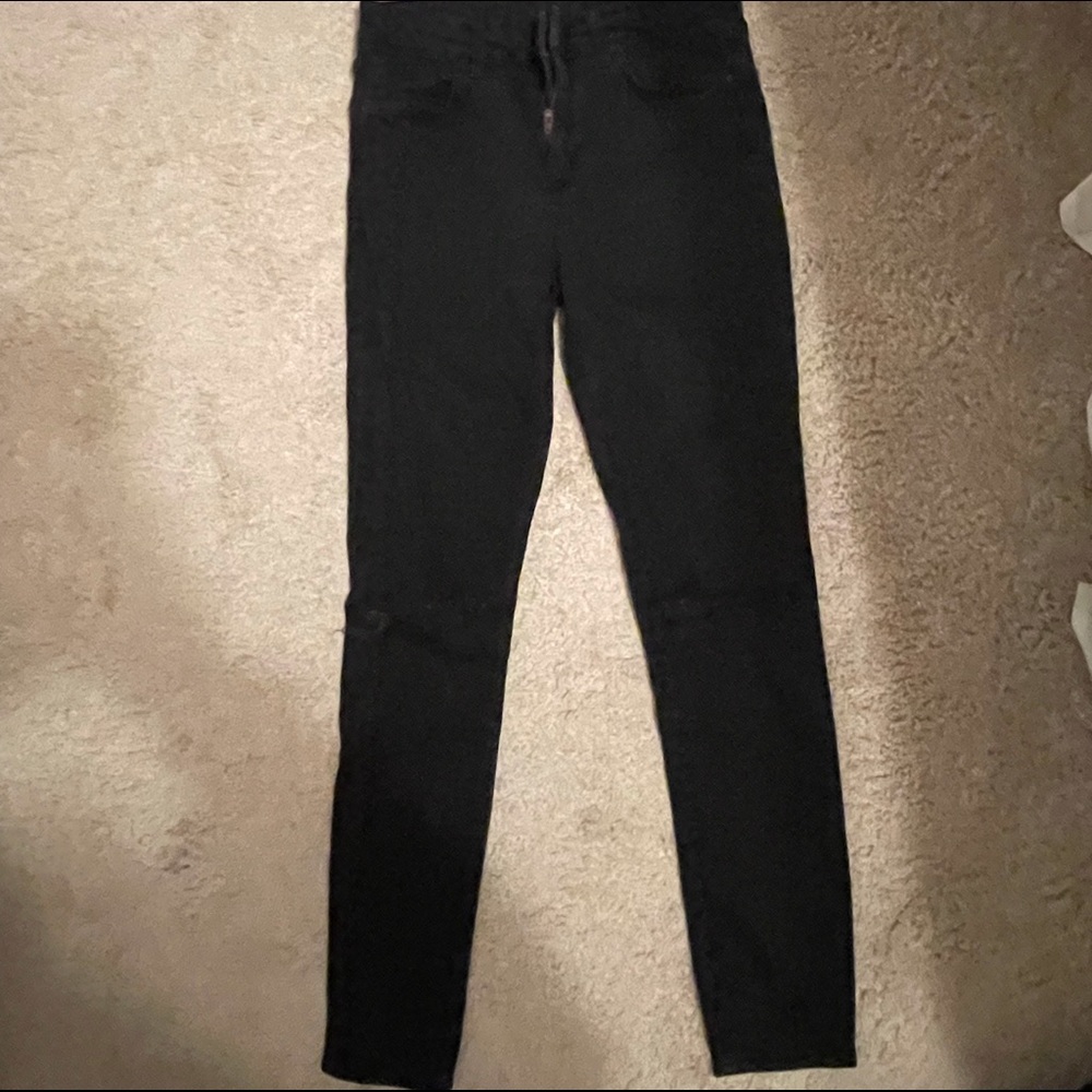 Black Topshop skinny jeans.